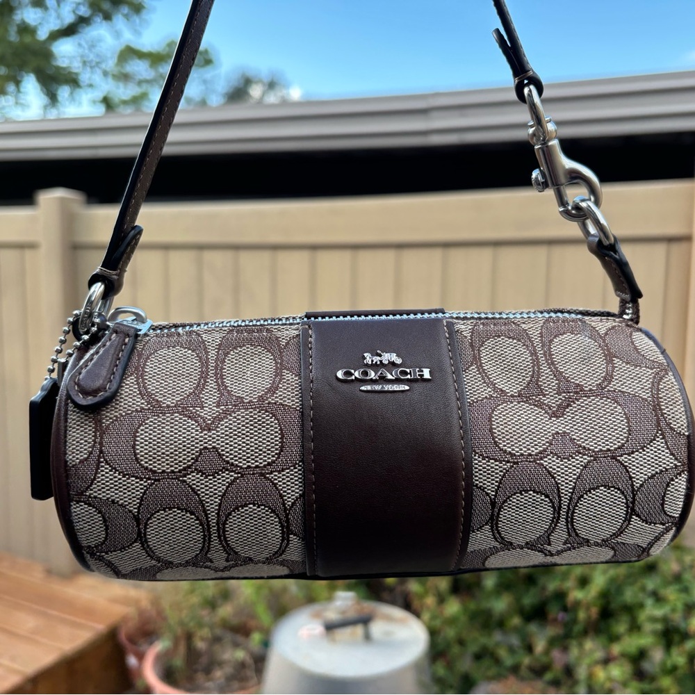 ***SOLD*** Coach Nolita Mini Barrel Bag in Signature
Jacquard Smooth Leather Map